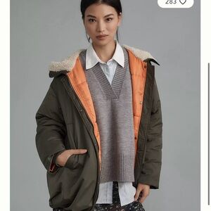 Orange Oversized Puffer Jacket with High Collar and Bright Lining
